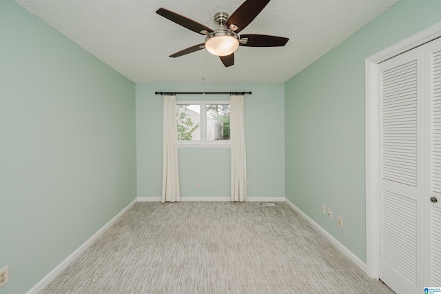 3655 Haven View Cir, Hoover, AL 35216 - unfurnished bedroom with a closet, a textured ceiling, carpet flooring, and a ceiling fan