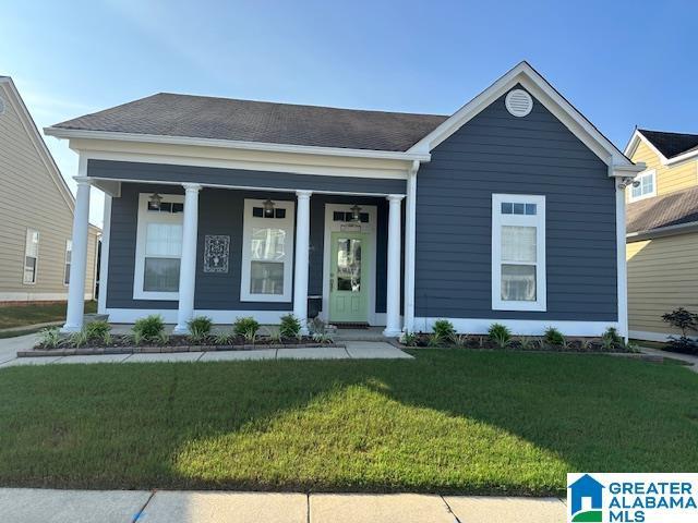 4650 Nicholas Dr, Bessemer, AL 35022 - view of front of home with a front yard and a porch