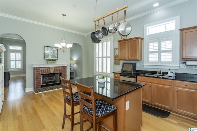 4650 Nicholas Dr, Bessemer, AL 35022 - kitchen with arched walkways, plenty of natural light, dark countertops, and crown molding
