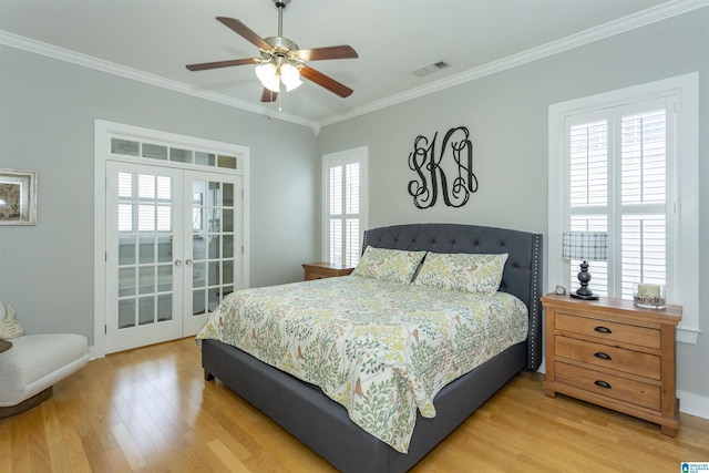 4650 Nicholas Dr, Bessemer, AL 35022 - bedroom with crown molding, light wood finished floors, french doors, and a ceiling fan