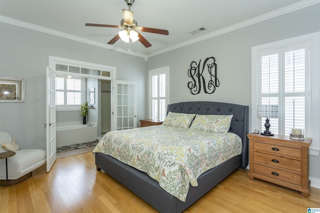 4650 Nicholas Dr, Bessemer, AL 35022 - bedroom featuring multiple windows, ornamental molding, light wood-style floors, french doors, and a ceiling fan