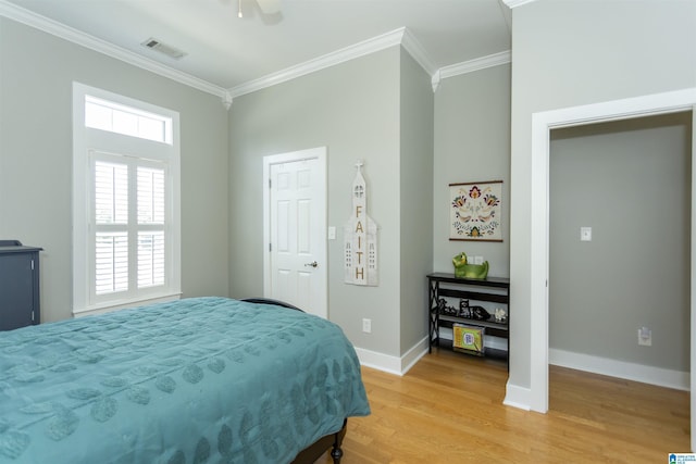 4650 Nicholas Dr, Bessemer, AL 35022 - bedroom featuring crown molding, light wood-type flooring, and a ceiling fan