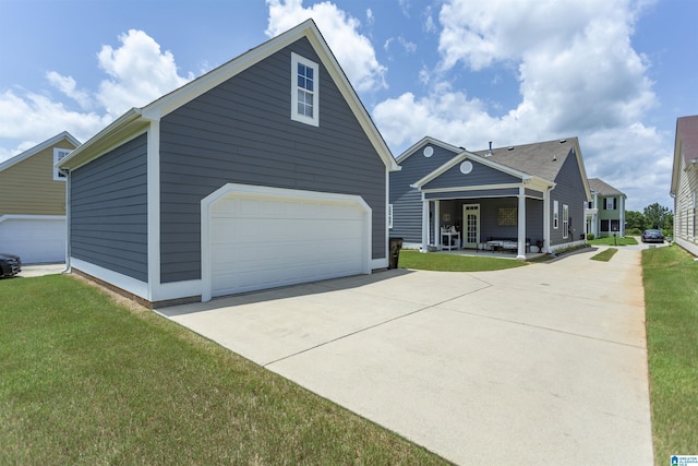 4650 Nicholas Dr, Bessemer, AL 35022 - view of front of property with a front yard, a detached garage, and an outbuilding