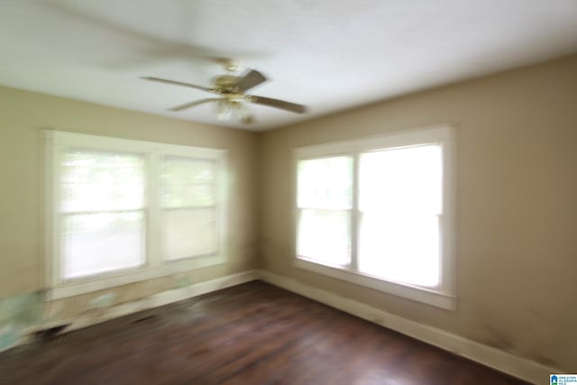 1420 47th St, Birmingham, AL 35208 - empty room with dark wood-style floors and a ceiling fan