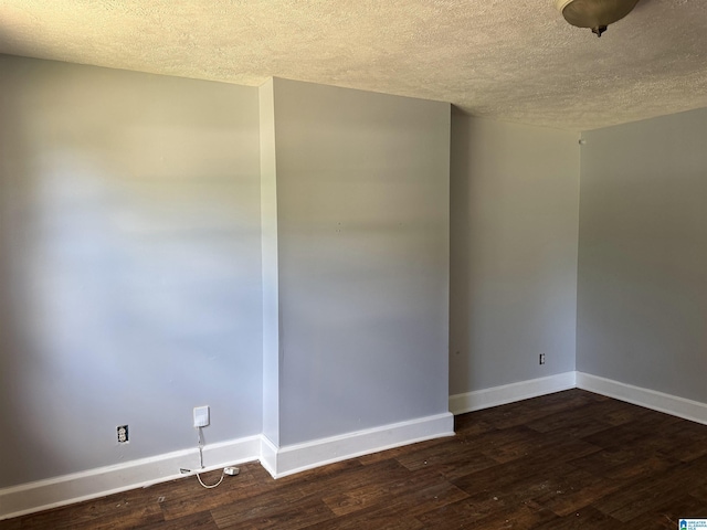 319 Lapsley Ave, Anniston, AL 36207 - empty room with a textured ceiling and dark wood-style floors