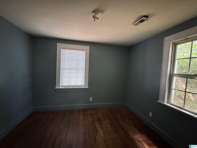 319 Lapsley Ave, Anniston, AL 36207 - spare room featuring dark wood finished floors and baseboards