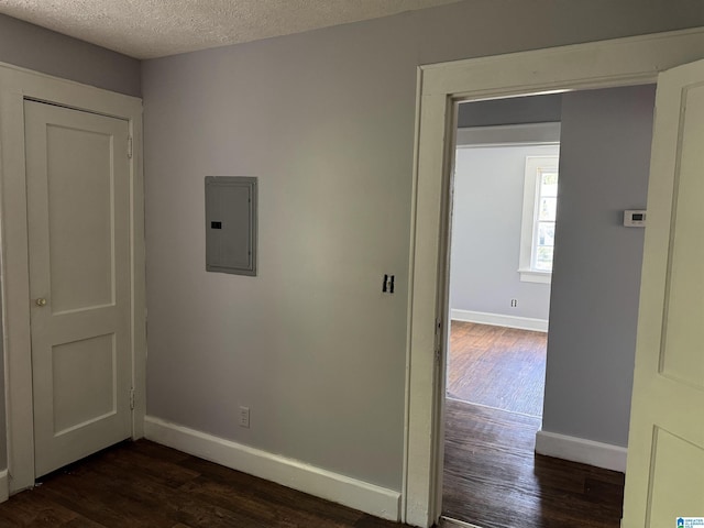 319 Lapsley Ave, Anniston, AL 36207 - spare room with electric panel, dark wood-style floors, and a textured ceiling