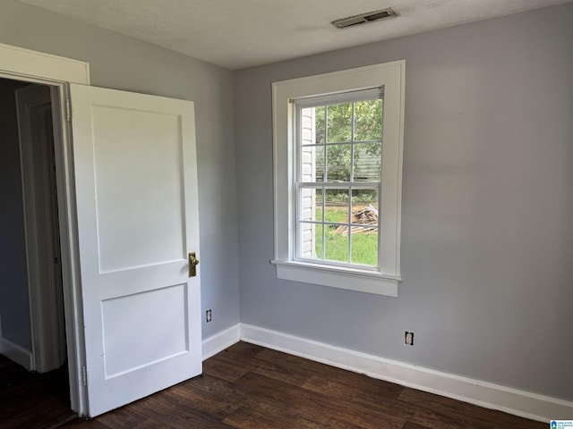 319 Lapsley Ave, Anniston, AL 36207 - empty room with dark wood finished floors and baseboards