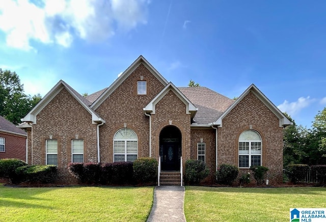 1819 Calgary Dr, Birmingham, AL 35022 - traditional-style home featuring a front yard and brick siding
