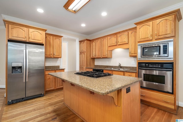 1819 Calgary Dr, Birmingham, AL 35022 - kitchen with stainless steel appliances, ornamental molding, a center island, light wood-style flooring, and stone counters