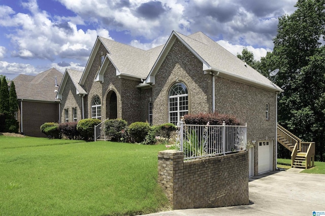 1819 Calgary Dr, Birmingham, AL 35022 - view of front facade featuring driveway, brick siding, a front yard, stairway, and a shingled roof