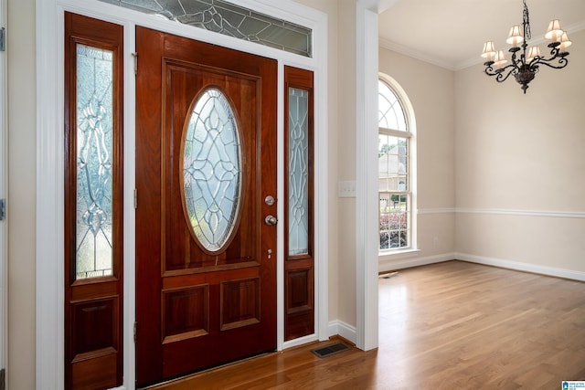 1819 Calgary Dr, Birmingham, AL 35022 - foyer entrance featuring a chandelier, wood finished floors, and crown molding