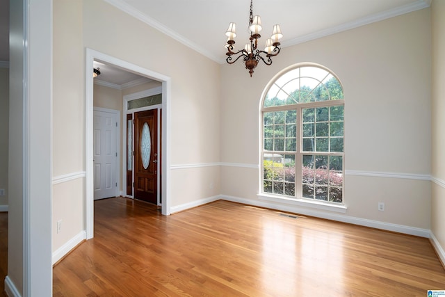 1819 Calgary Dr, Birmingham, AL 35022 - spare room featuring a chandelier, light wood finished floors, and crown molding