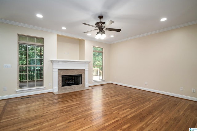 1819 Calgary Dr, Birmingham, AL 35022 - unfurnished living room featuring a ceiling fan, wood finished floors, ornamental molding, a fireplace, and recessed lighting