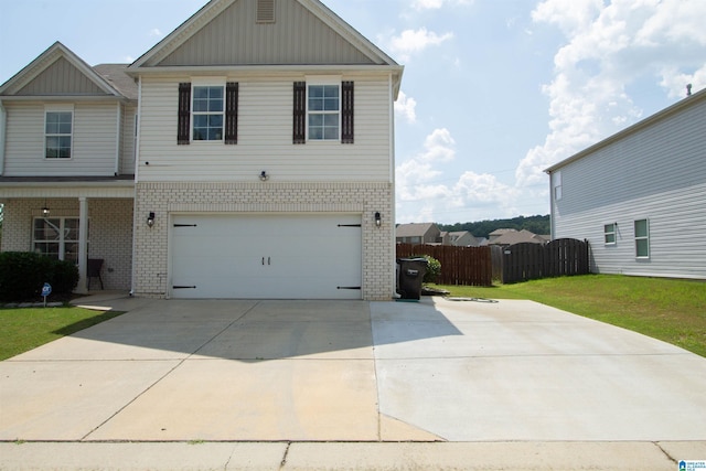 6497 Newbridge Dr, Bessemer, AL 35022 - view of front of property featuring brick siding, concrete driveway, and board and batten siding