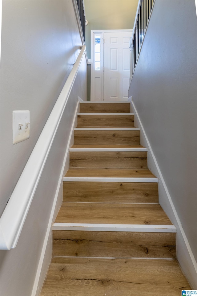 1025 Old Mill Rd, Anniston, AL 36207 - stairway featuring wood-type flooring
