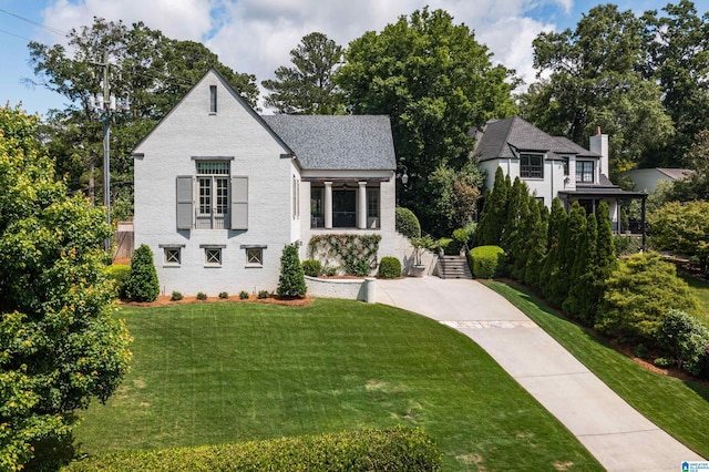 3600 Park Ln S, Mountain Brook, AL 35213 - view of front of property with a front lawn and a chimney