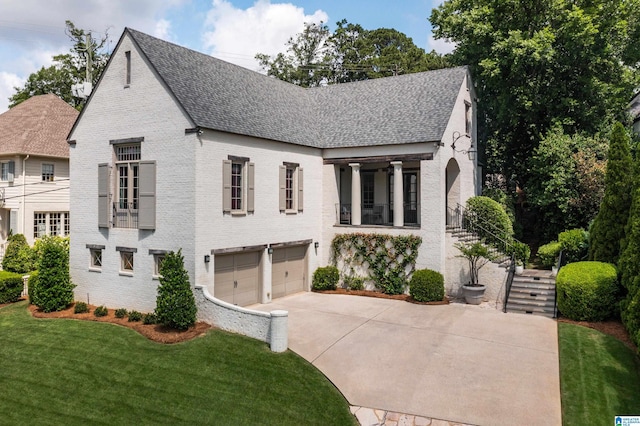 3600 Park Ln S, Mountain Brook, AL 35213 - view of front facade featuring driveway, stairway, brick siding, and a garage
