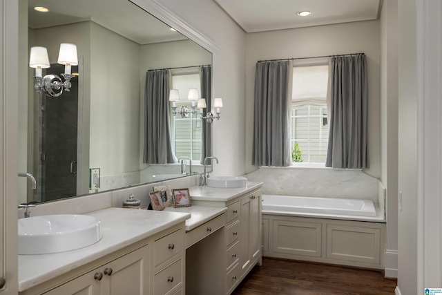 3600 Park Ln S, Mountain Brook, AL 35213 - bathroom featuring double vanity, a bath, wood finished floors, a shower stall, and recessed lighting