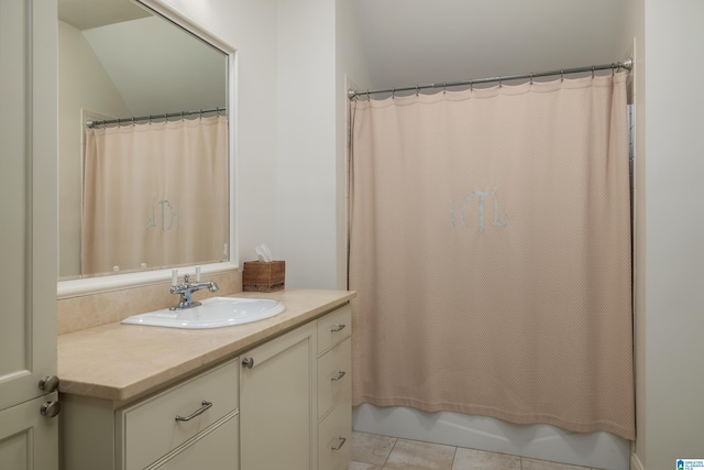 3600 Park Ln S, Mountain Brook, AL 35213 - bathroom featuring vanity, tile patterned flooring, lofted ceiling, and shower / bath combo