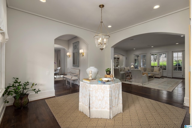 3600 Park Ln S, Mountain Brook, AL 35213 - dining space with arched walkways, wood finished floors, recessed lighting, and crown molding