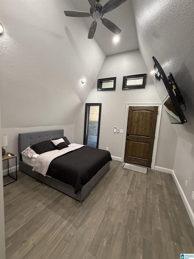 1926 County Road 621 S, Woodland, AL 36280 - bedroom featuring a textured ceiling, vaulted ceiling, wood finished floors, and a ceiling fan