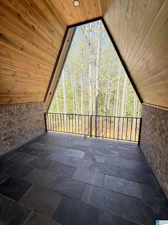 1926 County Road 621 S, Woodland, AL 36280 - unfurnished sunroom with lofted ceiling, healthy amount of natural light, and a forest view
