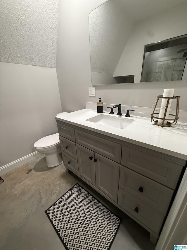 1926 County Road 621 S, Woodland, AL 36280 - bathroom featuring vanity, vaulted ceiling, unfinished concrete flooring, and a textured ceiling
