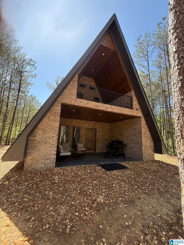 1926 County Road 621 S, Woodland, AL 36280 - back of house featuring brick siding and a patio area