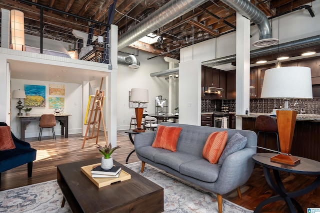 2217 2nd Ave Unit 303, Birmingham, AL 35203 - living room with a high ceiling, wood finished floors, and an office area