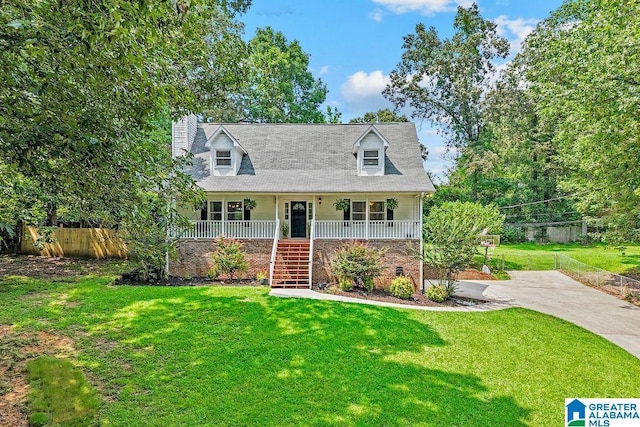 2089 Edenwood Cir, Hueytown, AL 35023 - cape cod-style house with covered porch, stairway, and a chimney
