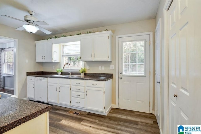 2089 Edenwood Cir, Hueytown, AL 35023 - kitchen featuring white dishwasher, dark wood-style flooring, dark countertops, white cabinets, and ceiling fan