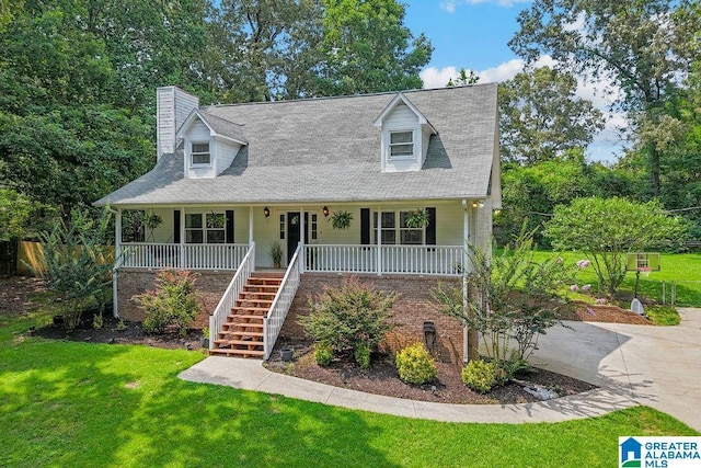 2089 Edenwood Cir, Hueytown, AL 35023 - cape cod house with covered porch, a chimney, a front lawn, and stairs