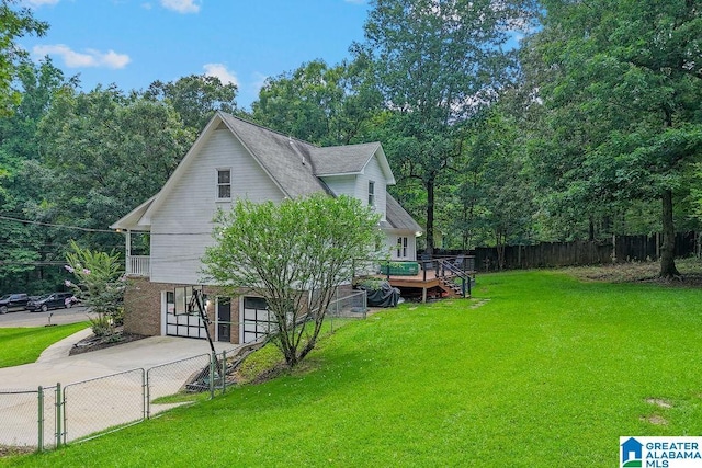 2089 Edenwood Cir, Hueytown, AL 35023 - view of property exterior featuring an attached garage, concrete driveway, and a deck
