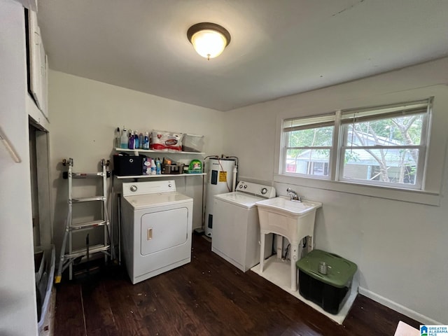 211 3rd St N, Pell City, AL 35125 - washroom with washing machine and dryer, electric water heater, and dark wood-type flooring