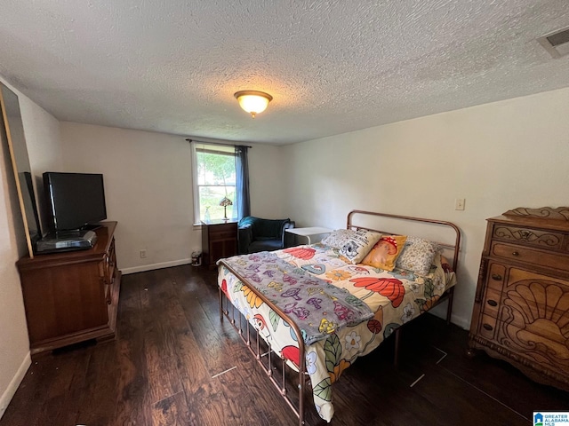 211 3rd St N, Pell City, AL 35125 - bedroom featuring wood finished floors and a textured ceiling