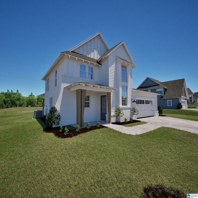 000010 Chelsea Ridge Trl, Columbiana, AL 35051 - view of front of house with board and batten siding, driveway, a front yard, and an attached garage