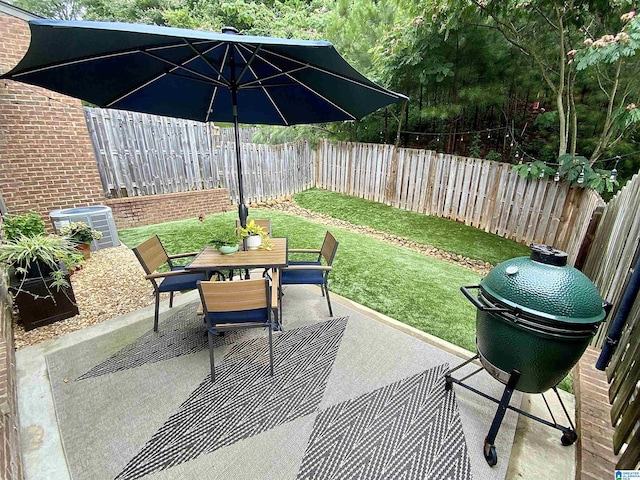 3858 Grants Ln, Irondale, AL 35210 - fenced backyard with a patio area, outdoor dining space, and area for grilling