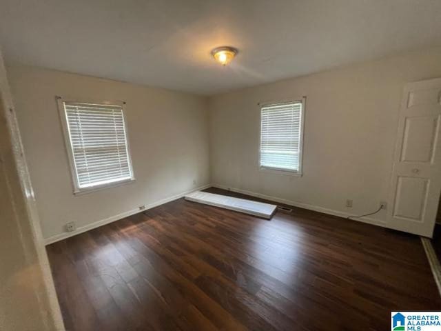 1637 17th St SW, Birmingham, AL 35211 - empty room with wood finished floors and baseboards