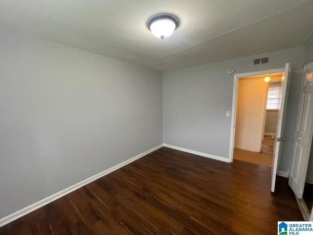 1637 17th St SW, Birmingham, AL 35211 - unfurnished room with baseboards and wood finished floors