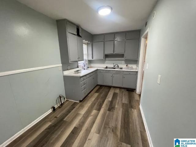 1637 17th St SW, Birmingham, AL 35211 - kitchen featuring gray cabinets, dark wood-style floors, and light countertops