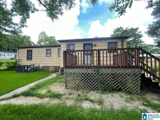 1637 17th St SW, Birmingham, AL 35211 - rear view of property with a deck, stairway, and a yard