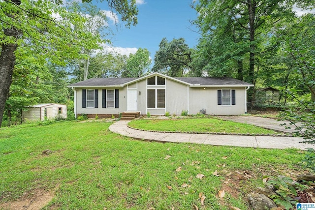5919 Creekwood Rd, Irondale, AL 35210 - view of front facade with a front lawn and a storage unit
