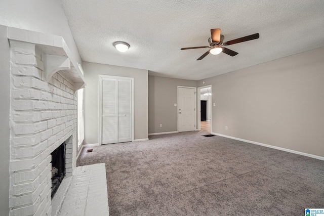 5919 Creekwood Rd, Irondale, AL 35210 - unfurnished living room featuring ceiling fan, a fireplace, carpet, and a textured ceiling