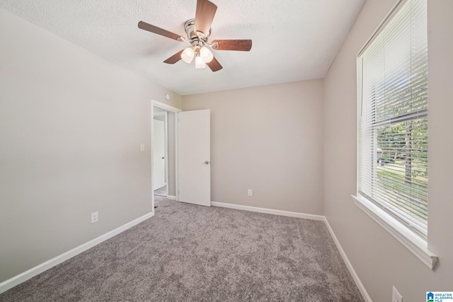 5919 Creekwood Rd, Irondale, AL 35210 - carpeted spare room with a ceiling fan and a textured ceiling