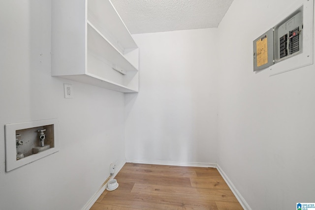 5919 Creekwood Rd, Irondale, AL 35210 - laundry room featuring washer hookup, light wood finished floors, and a textured ceiling