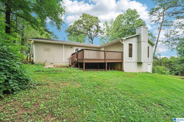 5919 Creekwood Rd, Irondale, AL 35210 - back of property featuring a deck, a chimney, a yard, and crawl space