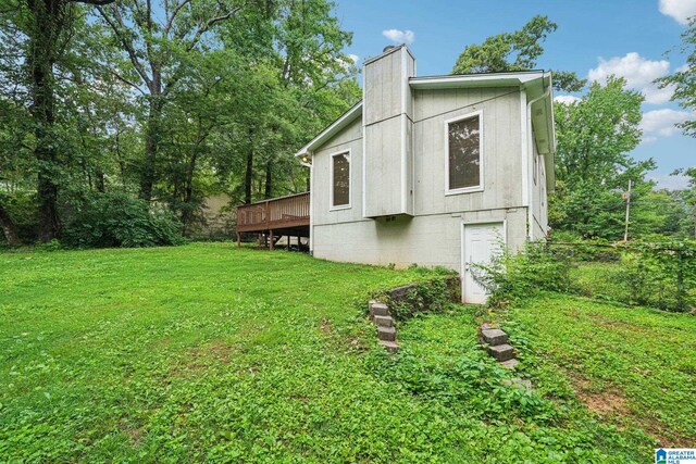 5919 Creekwood Rd, Irondale, AL 35210 - view of property exterior featuring a chimney, a yard, and a wooden deck