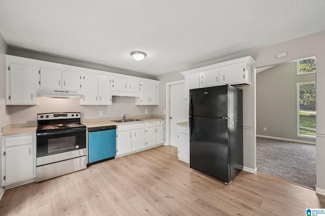 5919 Creekwood Rd, Irondale, AL 35210 - kitchen with freestanding refrigerator, stainless steel range with electric stovetop, dishwashing machine, under cabinet range hood, and white cabinetry
