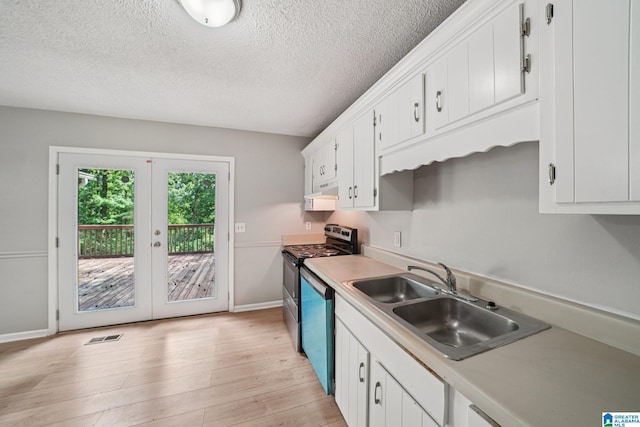 5919 Creekwood Rd, Irondale, AL 35210 - kitchen featuring stainless steel electric range, dishwasher, white cabinetry, light countertops, and light wood-type flooring